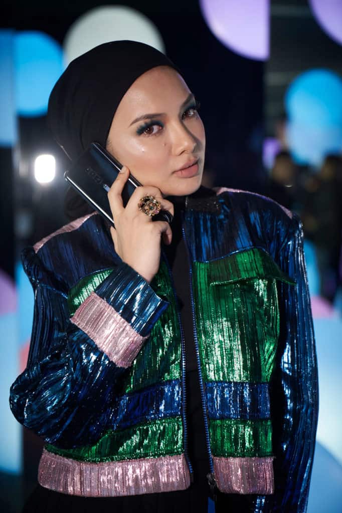 OPPO Reno series ambassador Neelofa, poses with the OPPO Reno 10x zoom at the official media launch