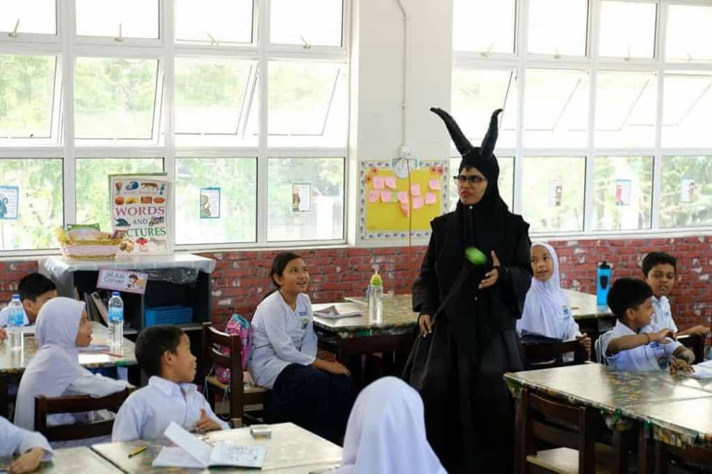 Ms. Ash captivates her students’ attention by bringing storybook characters to life – in this occasion, as Maleficent.