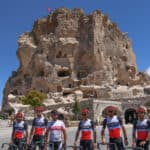 TSG (The Terrenganu Cycling Team) cyclists take a break from their training session at one of the “fairyland chimneys” for which the Cappadocia region in Turkey is famous