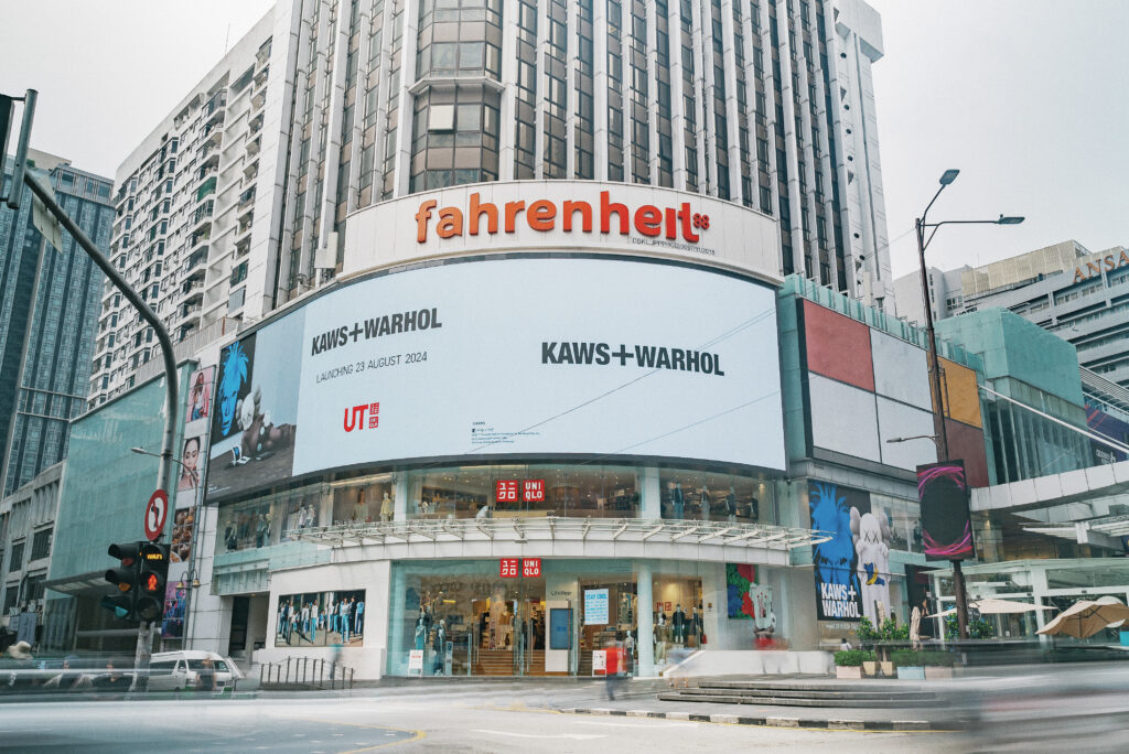 UNIQLO Turns Kuala Lumpur Storefronts into Artistic Showpieces for KAWS + Warhol UT Launch